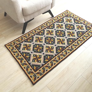 Handmade embroidered wool rug on jute base, 56x30 inches. Boho floor runner with textured wool stitching in natural earthy tones for rustic home decor.
