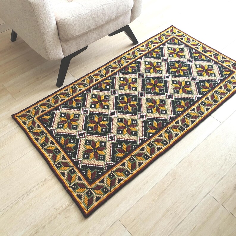 Handmade embroidered wool rug on jute base, 56x30 inches. Boho floor runner with textured wool stitching in natural earthy tones for rustic home decor.