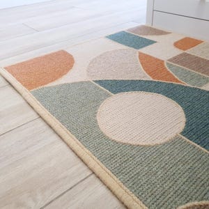Close-up of embroidered wool texture on jute base.