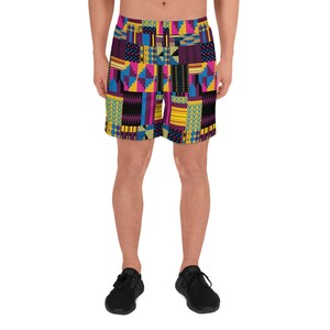 May include: A pair of athletic shorts with a colorful geometric pattern in shades of yellow, blue, pink, and black. The shorts are made of a lightweight, breathable fabric and are perfect for working out or running errands.
