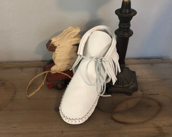 Inspired by a fusion of Native American and western cultures, these handcrafted moccasins are made completely of leather