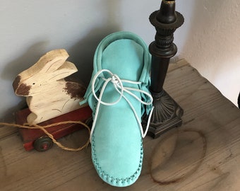 Inspired by a fusion of Native American and western cultures, these handcrafted moccasins are made completely of leather