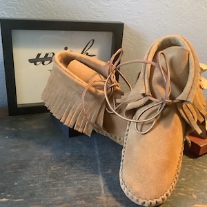 Inspired by a fusion of Native American and western cultures, these handcrafted moccasins are made completely of leather