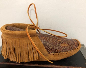 Inspired by a fusion of Native American and western cultures, these handcrafted moccasins are made completely of leather
