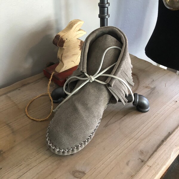 Inspired by a fusion of Native American and western cultures, these handcrafted moccasins are made completely of leather