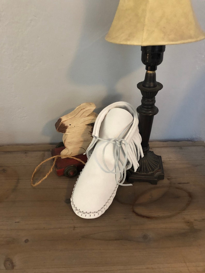 Inspired by a fusion of Native American and western cultures, these handcrafted moccasins are made completely of leather
