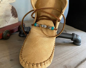 Inspired by a fusion of Native American and western cultures, these handcrafted moccasins are made completely of leather