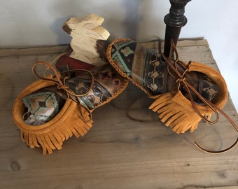 Inspired by a fusion of Native American and western cultures, these handcrafted moccasins are made completely of leather