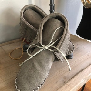 Inspired by a fusion of Native American and western cultures, these handcrafted moccasins are made completely of leather image 2
