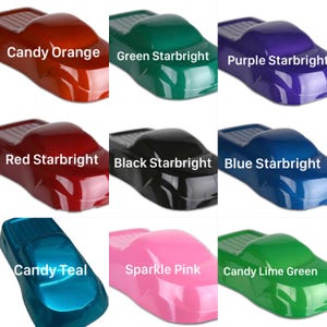May include: A grid of nine car-shaped paint samples in various glossy finishes. Colors include Candy Orange, Green Starbright, Purple Starbright, Red Starbright, Black Starbright, Blue Starbright, Candy Teal, Sparkle Pink, and Candy Lime Green.