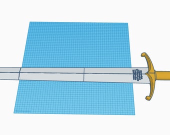 May include: A gold-colored sword with a silver blade and a round pommel. The sword is lying flat on a blue and white grid.
