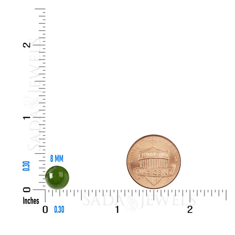 May include: A green gemstone measuring 8 mm in diameter, next to a US penny for size comparison. The gemstone is round and smooth.