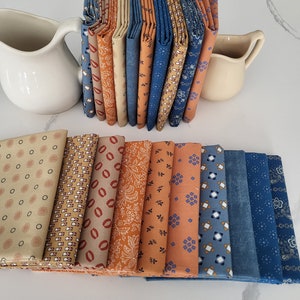 Denim blue and cheddar Civil War fat quarters fabric bundle.  10 fat quarters.  Tan, pumpkin coloring, denim blue.  Great quality.  Unique