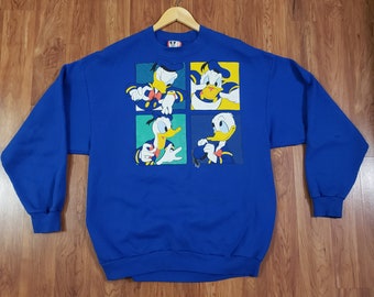 Vintage 1990s Disney Designs Donald Duck sweater Adult Large blue crewneck heavy screen print big spellout vibrant colors made in USA