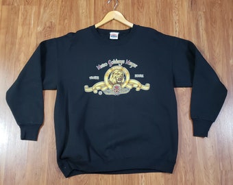 Vintage 1990s MGM Metro Goldwyn Mayer Lion Logo Movie Promo pullover black sweater Sweatshirt Size XL by Nutmeg made in USA