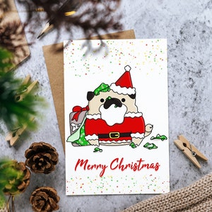 Cartolina di Natale: divertente Babbo Natale Carlino che scarta il regalo di Natale 2 / Biglietto di auguri "Buon Natale" per le festività natalizie