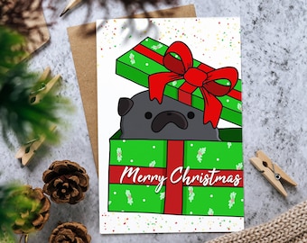 Christmas Card: Black Pug in Gift Box "Merry Christmas" Greeting Card for Holiday Season