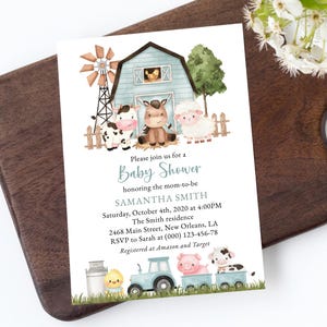 May include: A baby shower invitation featuring a watercolor illustration of a farm scene with a barn, windmill, and farm animals. The invitation text reads "Please join us for a Baby Shower" and includes event details.