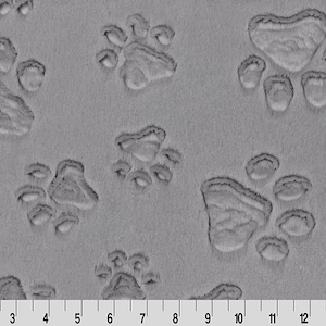 May include: Gray fabric with a repeating pattern of embossed paw prints.