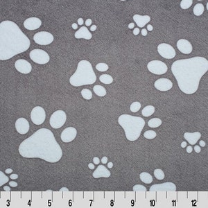 May include: Gray fabric with a white paw print pattern. The fabric is soft and fuzzy.