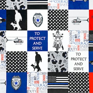 May include: A blue and black fabric with a patchwork design featuring police-themed images, including police cars, helicopters, badges, and officers. The fabric also includes the phrase "To Protect and Serve" repeated throughout.