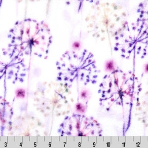 May include: White fabric with a purple and pink floral pattern. The flowers are stylized and resemble dandelions.