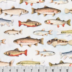 May include: A white fabric with a repeating pattern of colorful fish. The fish are in various sizes and positions, with some facing left and others facing right. The fabric has a subtle watercolor effect.