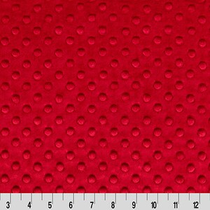 May include: Red minky fabric with a small, raised dot pattern.