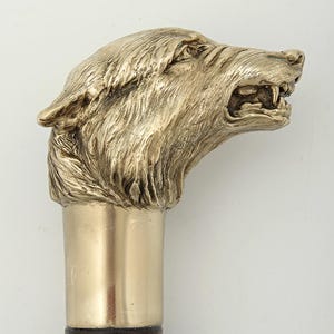 Сane and walking stick "wolf", brass, wood.