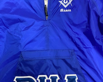May include: A royal blue windbreaker jacket with a white embroidered Masonic symbol and the text "Prince Hall Mason" on the front. The back of the jacket has a white embroidered "PHA" on a blue background.