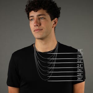 May include: A model wearing a black t-shirt with a silver chain necklace. The image shows different chain lengths from 18 inches to 30 inches. The text "EIJI" is printed on the bottom of the image.