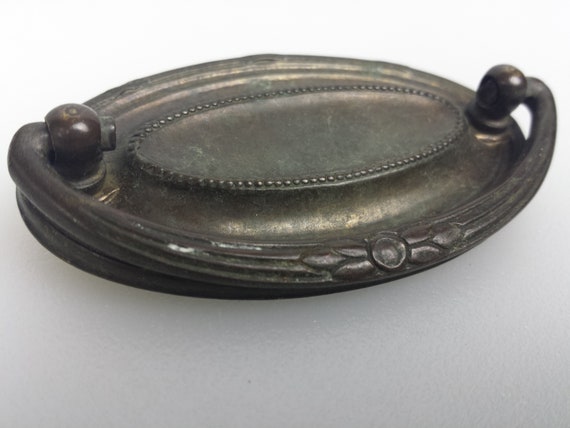 One Original Vintage brass pull with steel bail