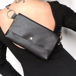 Real Little backpack on a gals upper back with flap and LBD (Little Black Dress)