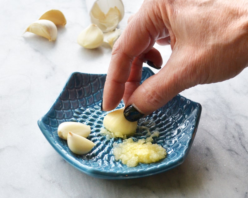 The Grate Plate Ceramic Grater 3 Piece set: Ceramic Grating Plate, Silicone Garlic Peeler and Wooden Handle Gathering Brush Teal