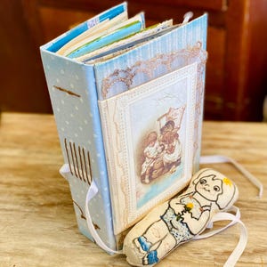 Children Junk journal handmade. Large art journal with fabric doll. Intervened old children's gold book, paper, cloth, lace, collage vintage