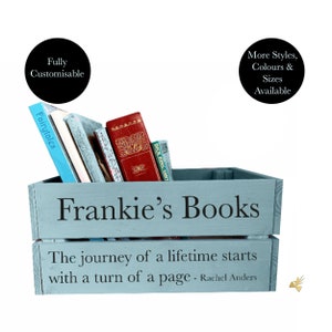 May include: A light blue wooden crate labeled "Frankie's Books" filled with various books. The crate has the quote "The journey of a lifetime starts with a turn of a page - Rachel Anders." The text "Fully Customisable" and "More Styles, Colours & Sizes Available" are also visible.