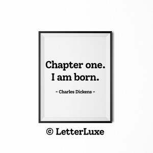 May include: Black and white printable quote art featuring the text "Chapter one. I am born." attributed to Charles Dickens. The quote is framed in a black frame and the copyright symbol and "LetterLuxe" are printed below the quote.