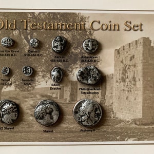 May include: A set of ten silver-colored coins depicting historical figures and events from the Old Testament. The coins are arranged in two rows on a brown background with a picture of a stone building in the background. The coins are labeled with the name of the figure or event and the dates of their reign.