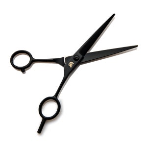 May include: Black hair cutting shears with a gold Spartan helmet logo. The shears have offset handles.
