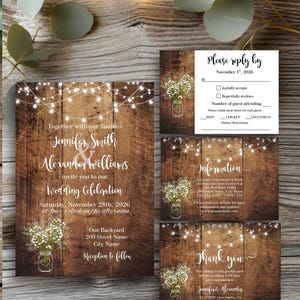 May include: A wedding invitation suite featuring a dark wood background with string lights and baby's breath in a mason jar. The set includes an invitation, a reply card, an information card, and a thank you card with white script text.