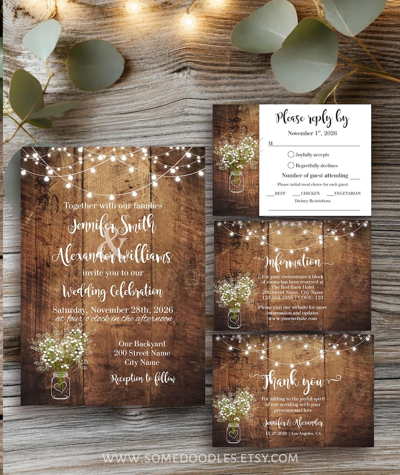 May include: A wedding invitation suite featuring a dark wood background with string lights and baby's breath in a mason jar. The set includes an invitation, a reply card, an information card, and a thank you card with white script text.