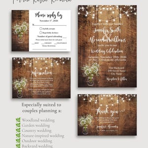 May include: A wedding stationery set featuring a dark brown wood grain background, white string lights, and a mason jar filled with baby's breath flowers. The set includes an invitation, a reply card, an information card, and a thank you card.
