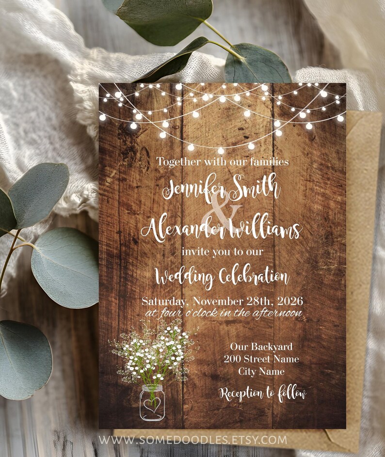 May include: A rectangular wedding invitation card featuring a dark brown wood grain background, white string lights at the top, and a mason jar with baby's breath at the bottom. The text reads: Together with our families, Jennifer Smith & Alexander Williams invite you to our Wedding Celebration, Saturday, November 28th, 2026 at four o'clock in the afternoon, Our Backyard, 200 Street Name, City Name, Reception to follow.