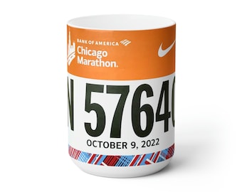 May include: White ceramic mug with a colorful design featuring the Bank of America Chicago Marathon logo, the number 57640, and the date October 9, 2022.