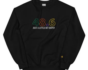 May include: Black sweatshirt with a rainbow-coloured graphic of the number 48.6 and the text "Just a little bit dopey".
