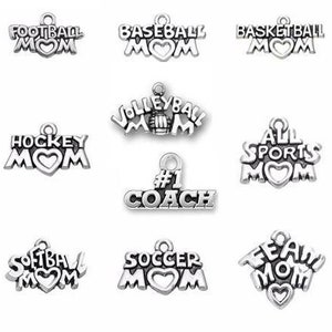 May include: A set of ten silver charm pendants with different sports themes. Each charm features a heart and the words "Mom" or "Team Mom". The sports include: Football, Baseball, Basketball, Hockey, Volleyball, Soccer, Softball, and All Sports.