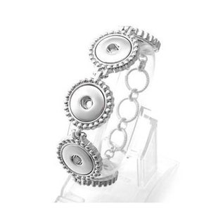 May include: Silver bracelet with three round snap-on charms. The bracelet has a chain link design and is decorated with small beads.