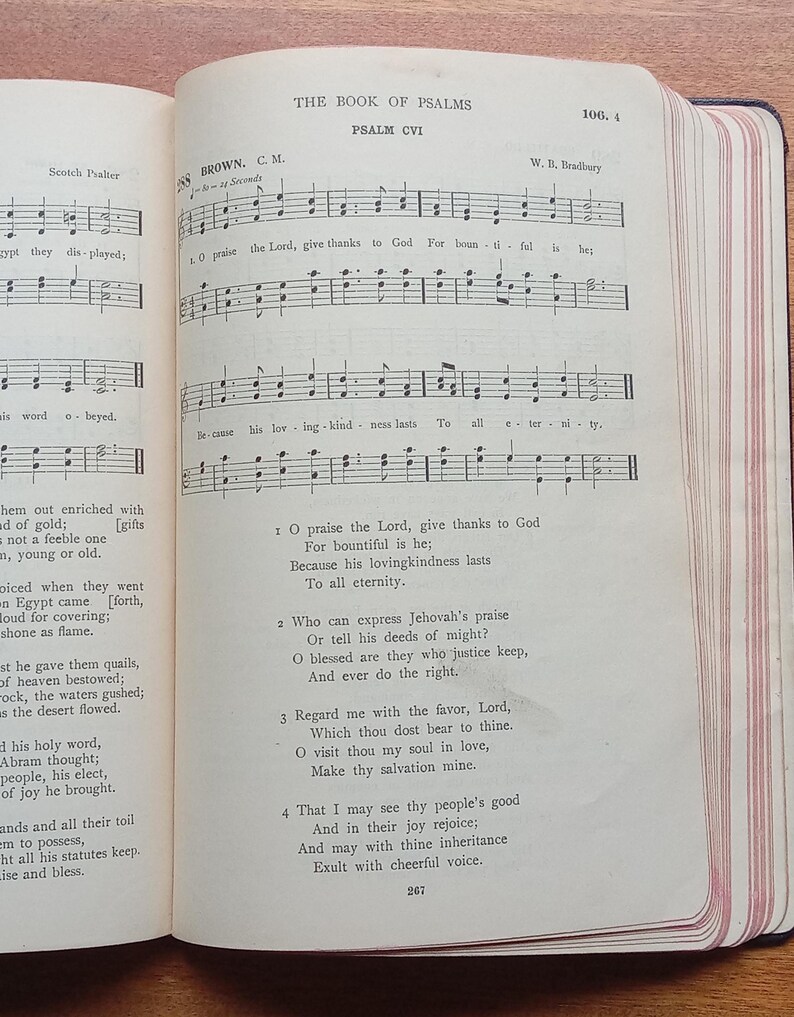May include: An open book displaying The Book of Psalms, Psalm CVI, with printed musical notation and lyrics. The page features the title, hymn number 288, composer W. B. Bradbury, and verses 1 through 4. The paper edges have thin red stripes.