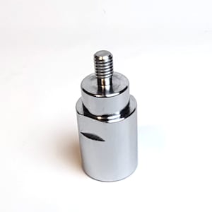 May include: A silver metal adapter with a threaded end. The adapter is cylindrical and has a smooth surface.
