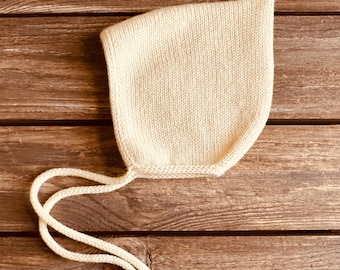 Hand-Knitted Merino Wool Baby Bonnet: Seamless, Tie-Fit, Buttercream Color